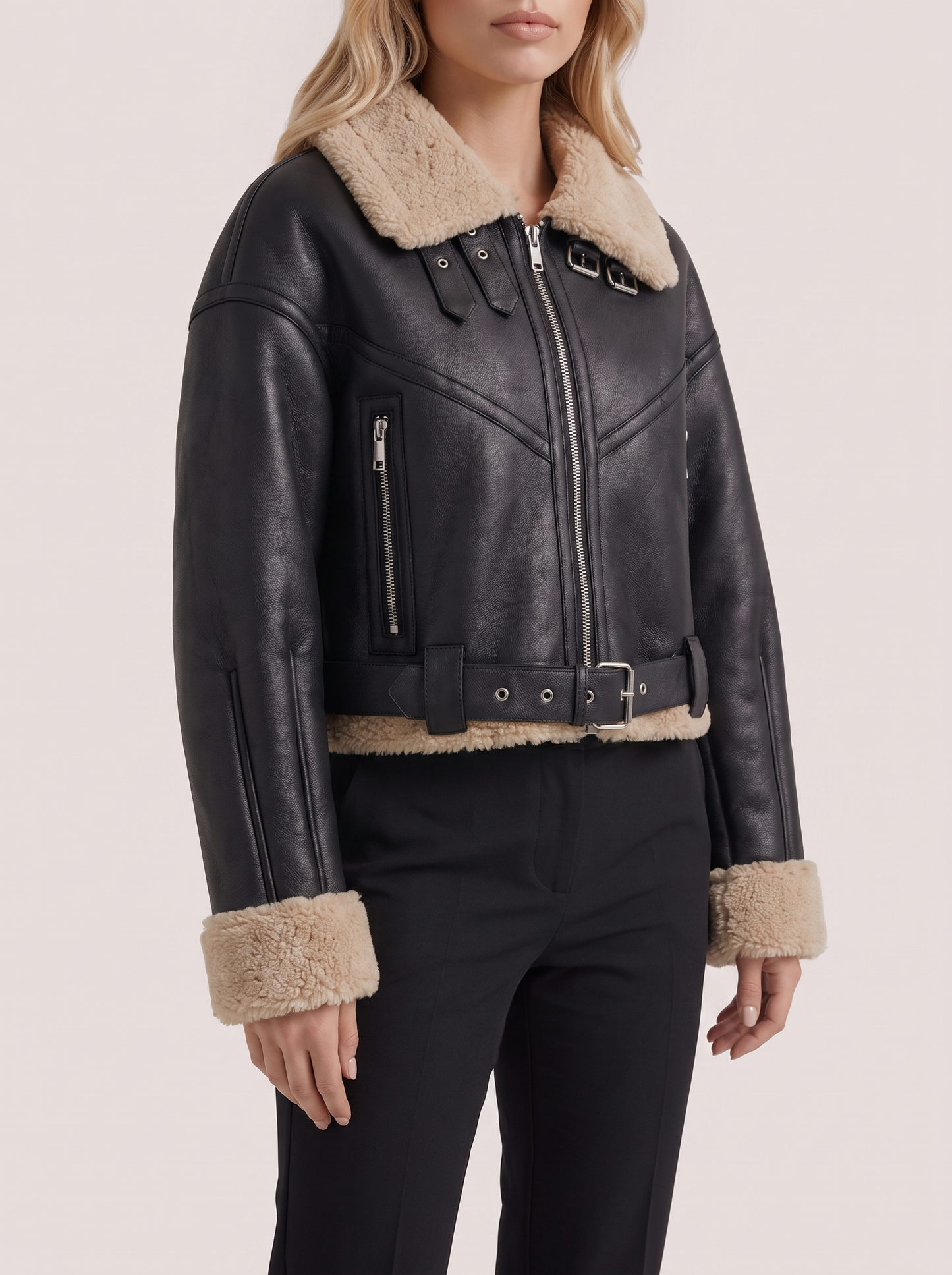Women black cropped faux leather aviator jacket with faux shearling collar and belt, fabric closeup