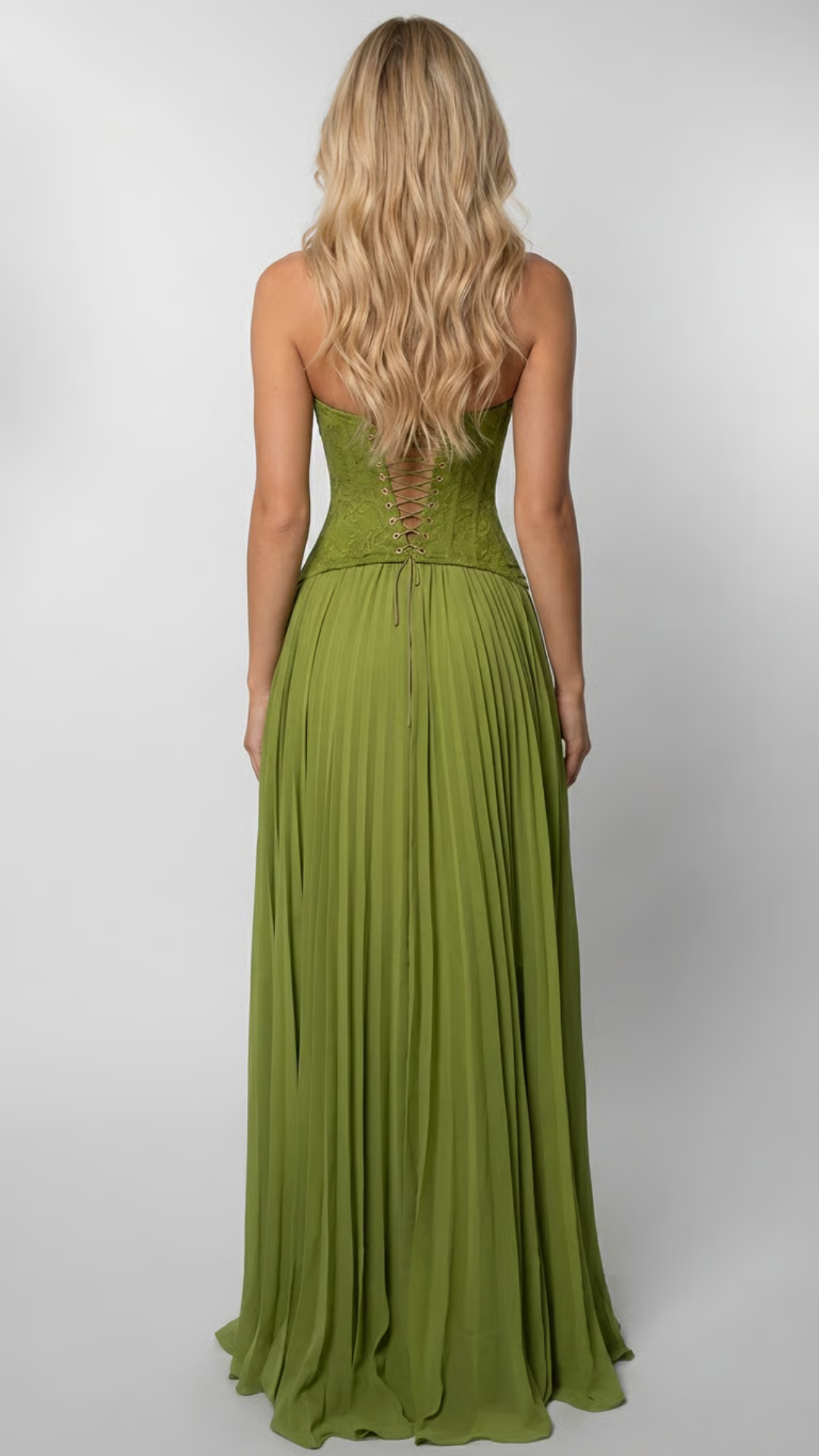 Back view of green lace corset maxi dress with lace-up back detail.