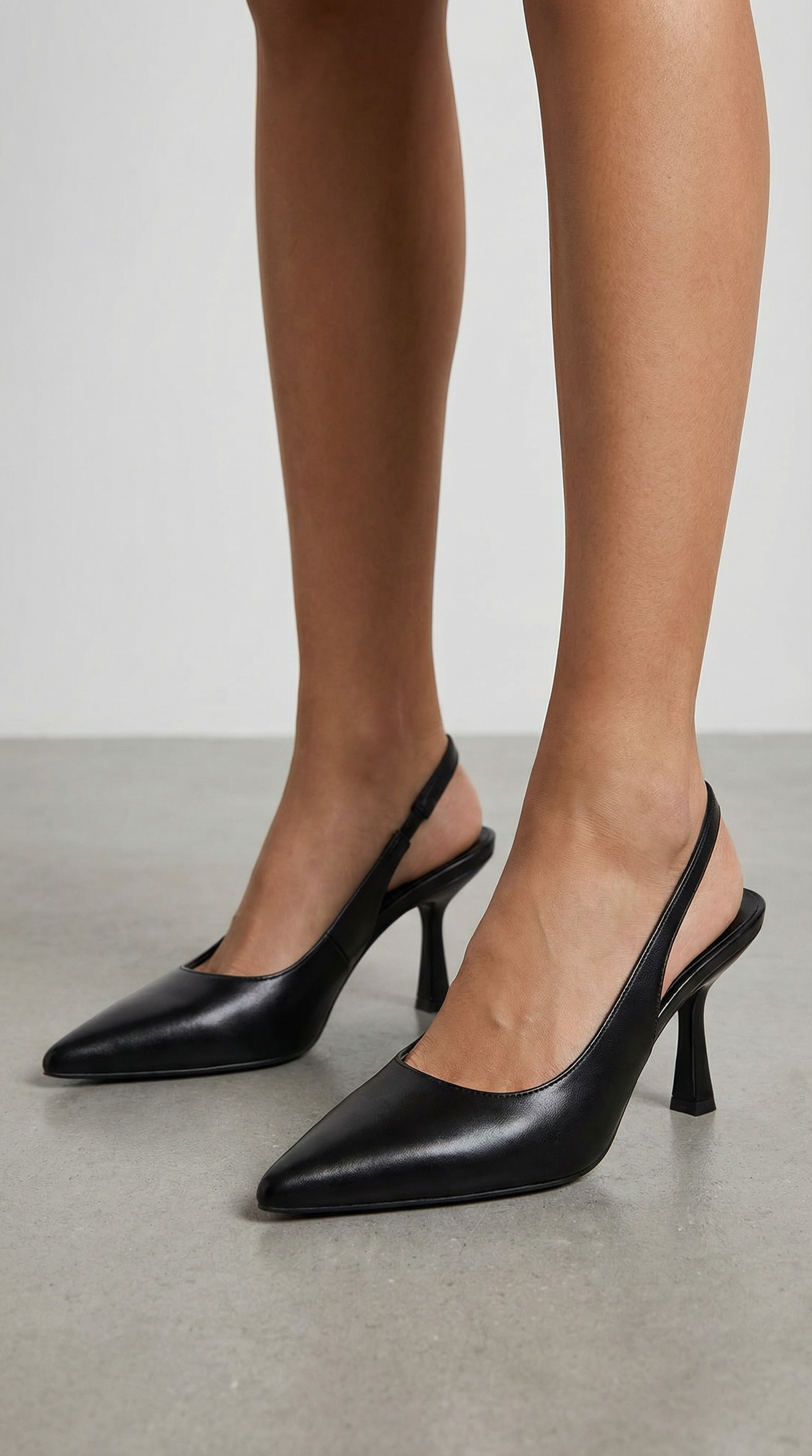 Women black heeled sandals with pointed toe and slingback strap