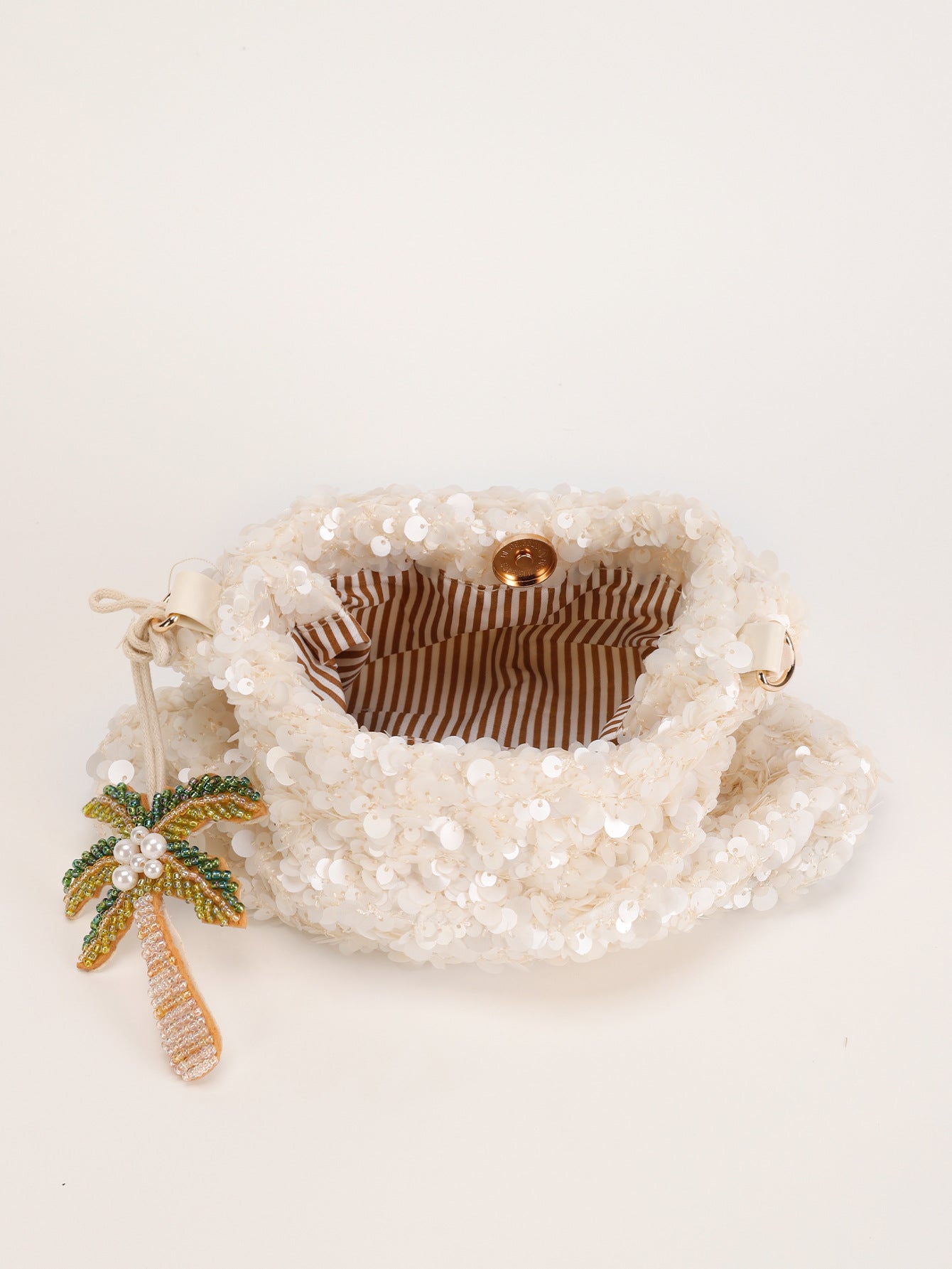 Women white shoulder bag with palm charm and sequin finish