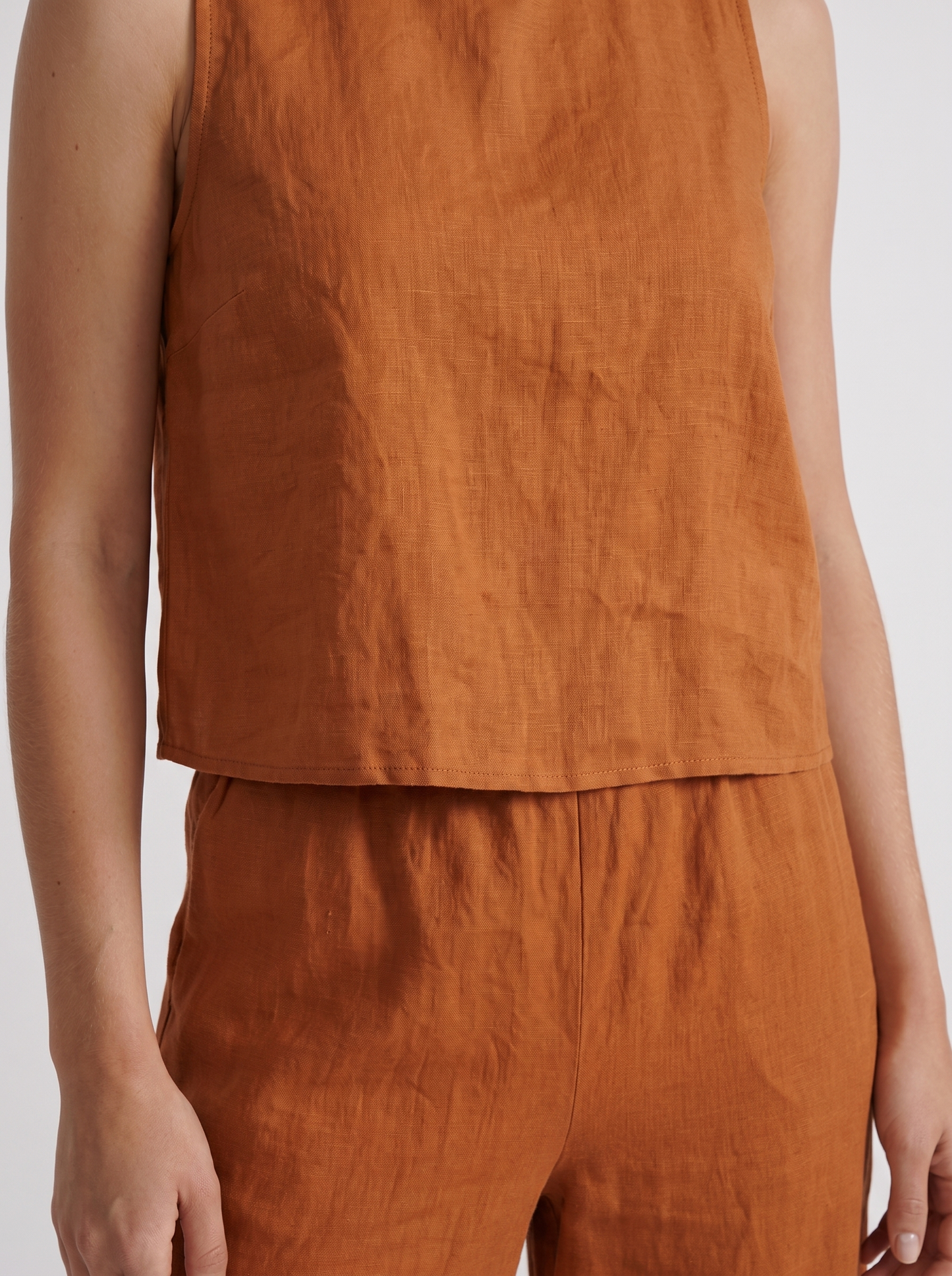 Women khaki pants set with sleeveless linen top and round neckline