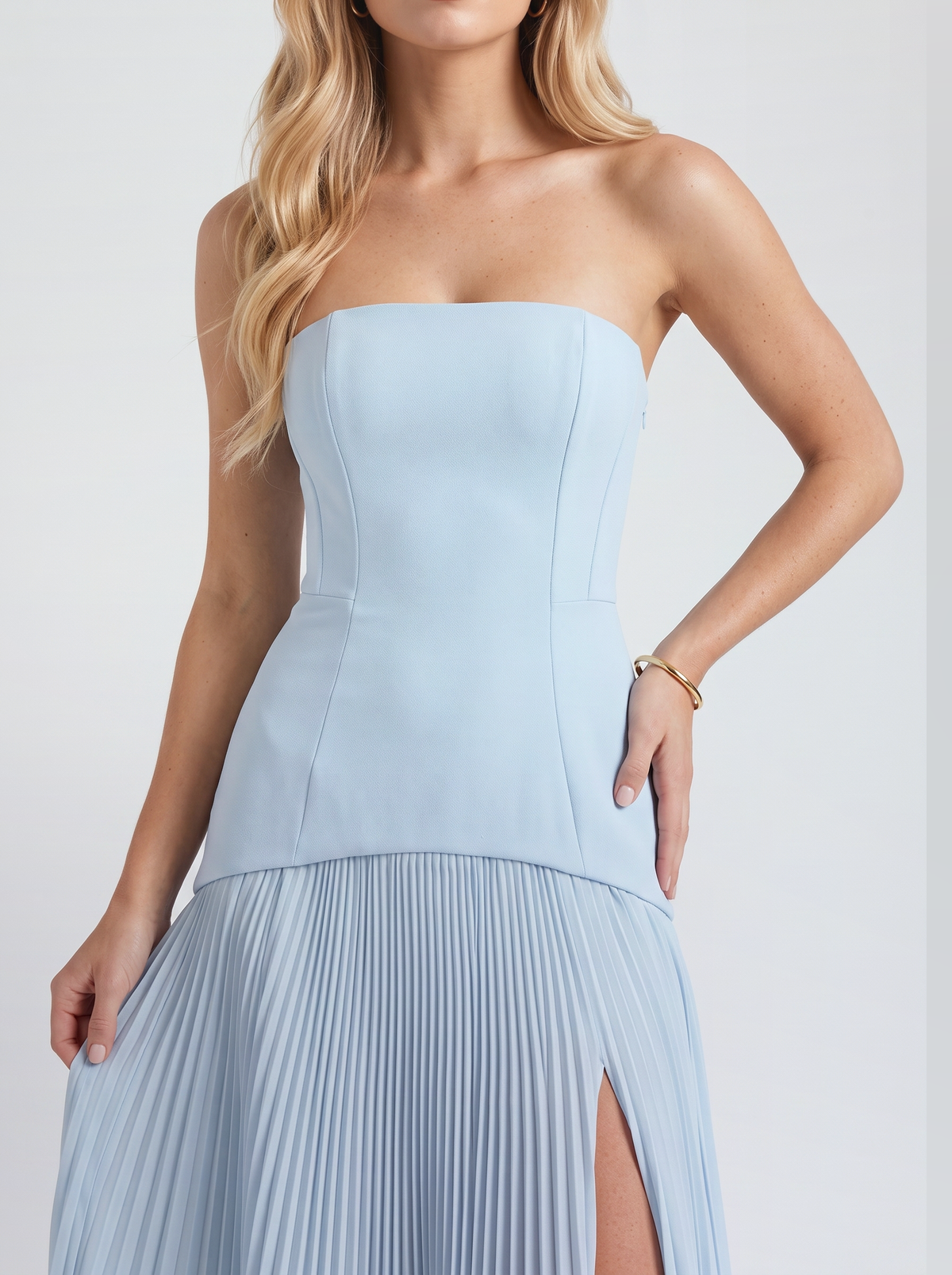 Women light blue strapless maxi dress, close view of the fluted pleated skirt