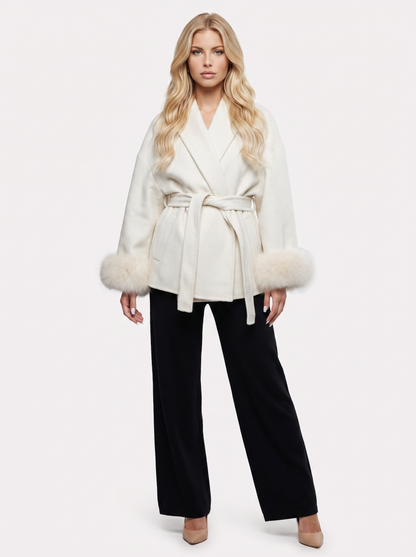 Women white wool blend wrap jacket with shawl collar, tie belt and faux fur cuffs, front view