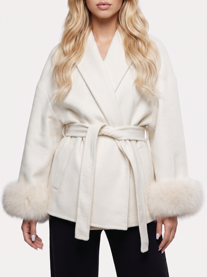 Women white wool blend wrap jacket with shawl collar, tie belt and faux fur cuffs, fabric closeup