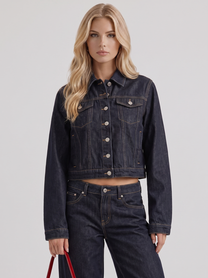 Women indigo cropped denim trucker jacket with contrast topstitching and flap pockets, front detail