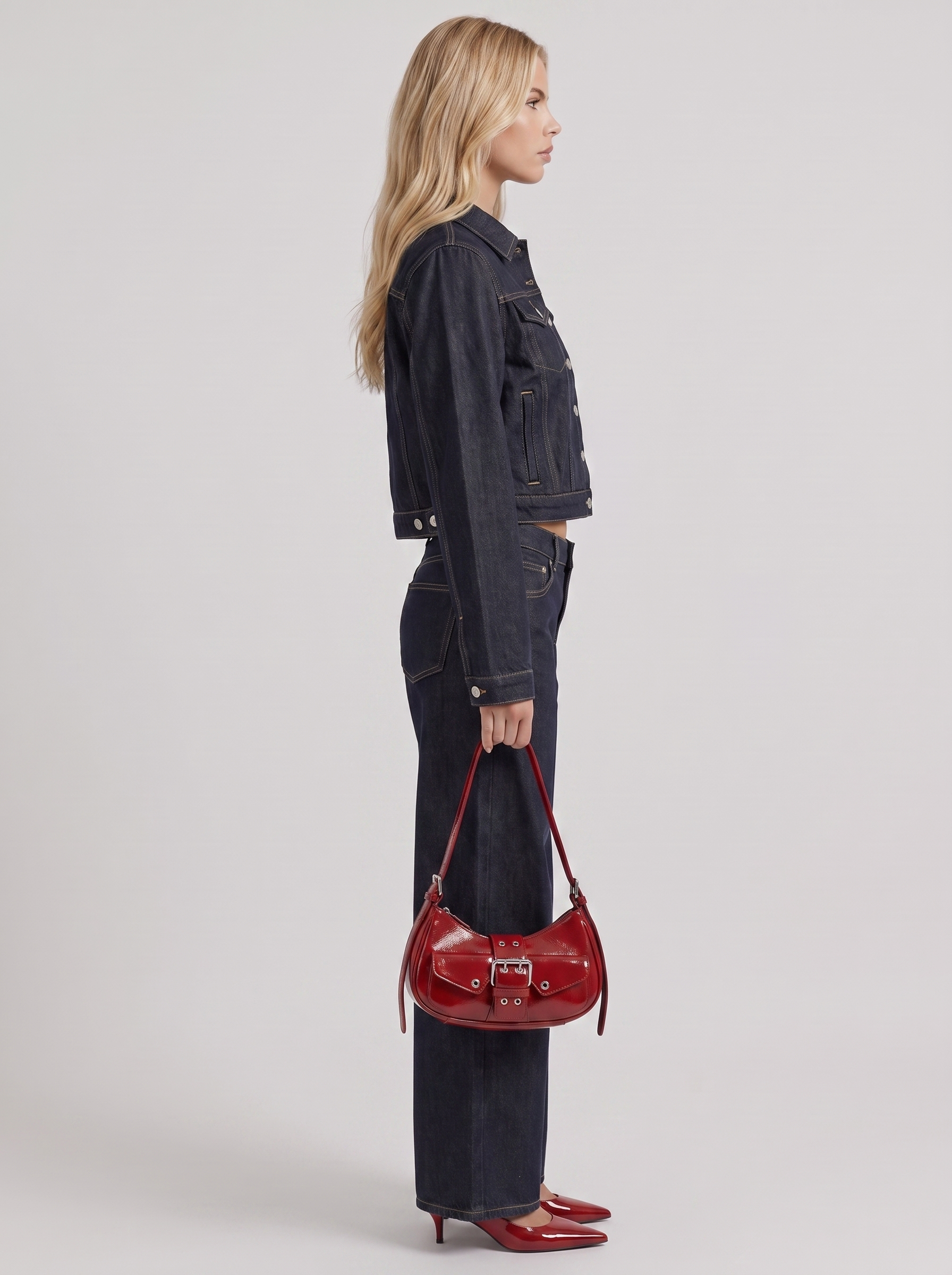 Women indigo cropped denim trucker jacket with contrast topstitching and flap pockets, side view