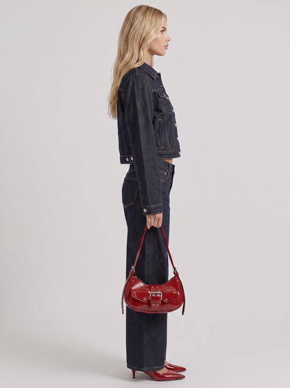 Women indigo cropped denim trucker jacket with contrast topstitching and flap pockets, side view