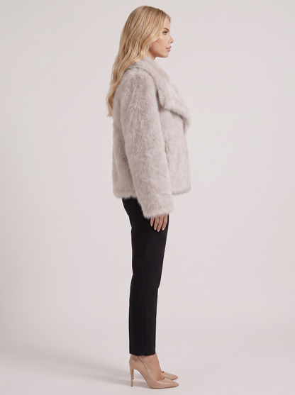 Women beige long pile faux fur jacket with shawl collar and open front, side view