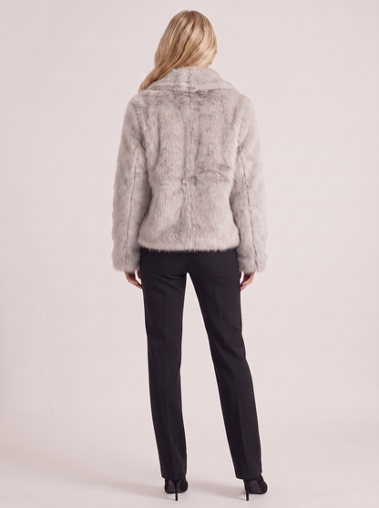 Women beige long pile faux fur jacket with shawl collar and open front, back view