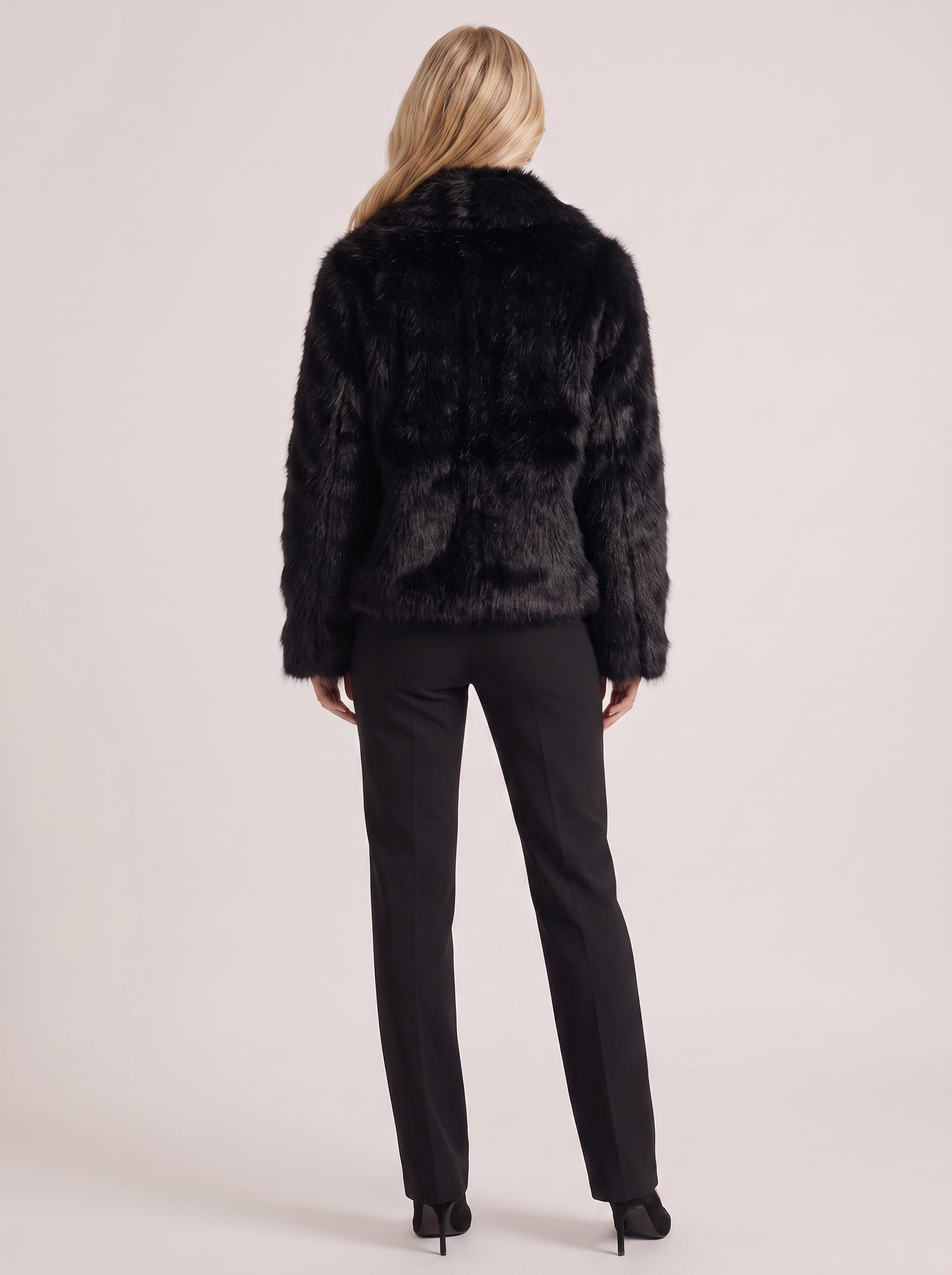 Women black long pile faux fur jacket with shawl collar and open front, back view