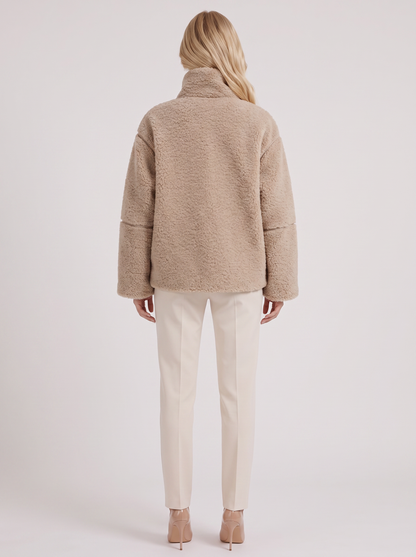 Women beige oversized teddy borg jacket with stand collar and two way zip, back view