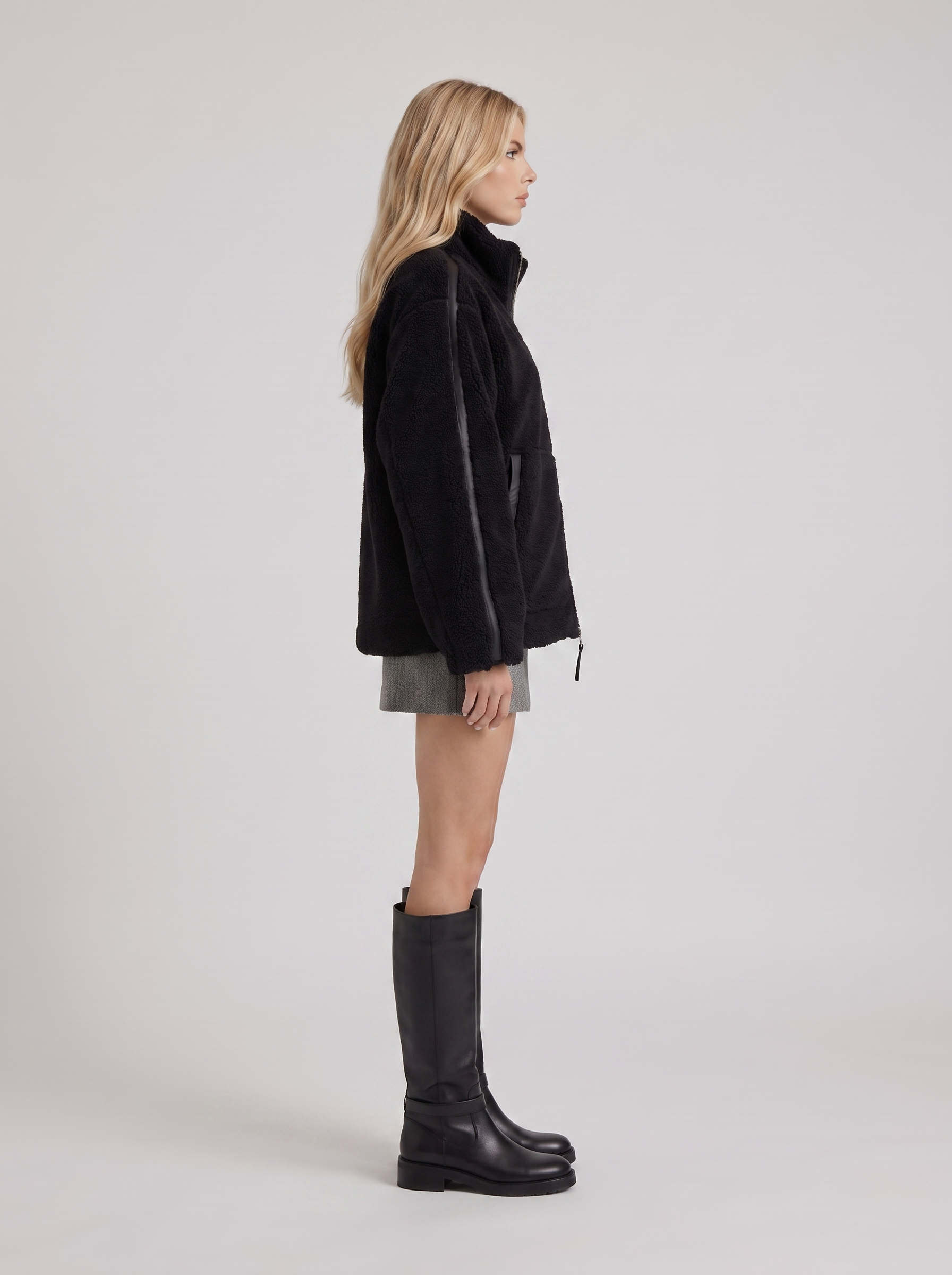 Women black oversized teddy borg jacket with stand collar and two way zip, side view