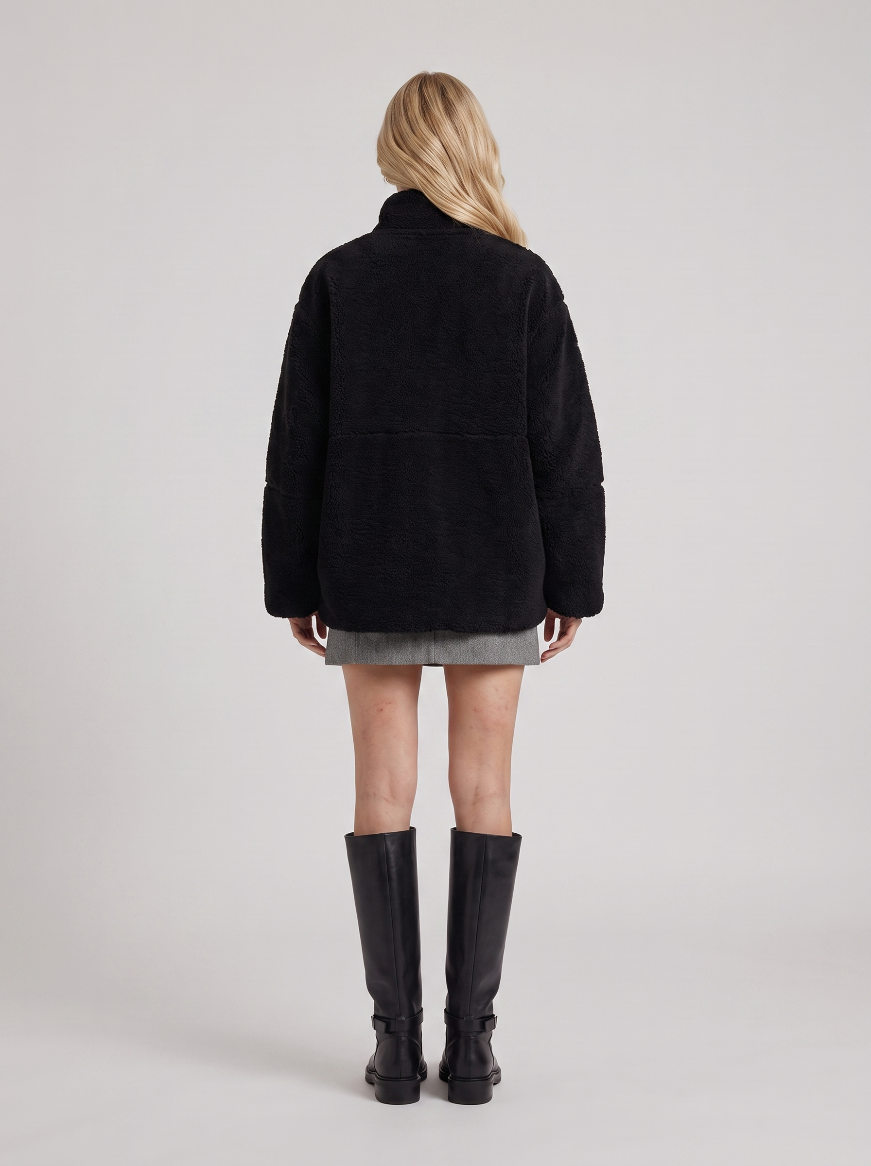 Women black oversized teddy borg jacket with stand collar and two way zip, back view