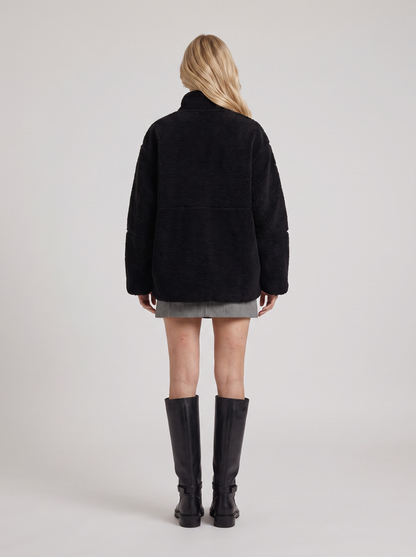 Women black oversized teddy borg jacket with stand collar and two way zip, back view
