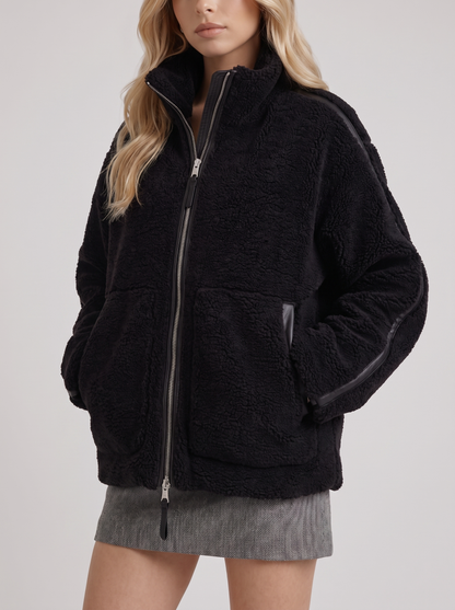 Women black oversized teddy borg jacket with stand collar and two way zip, fabric closeup