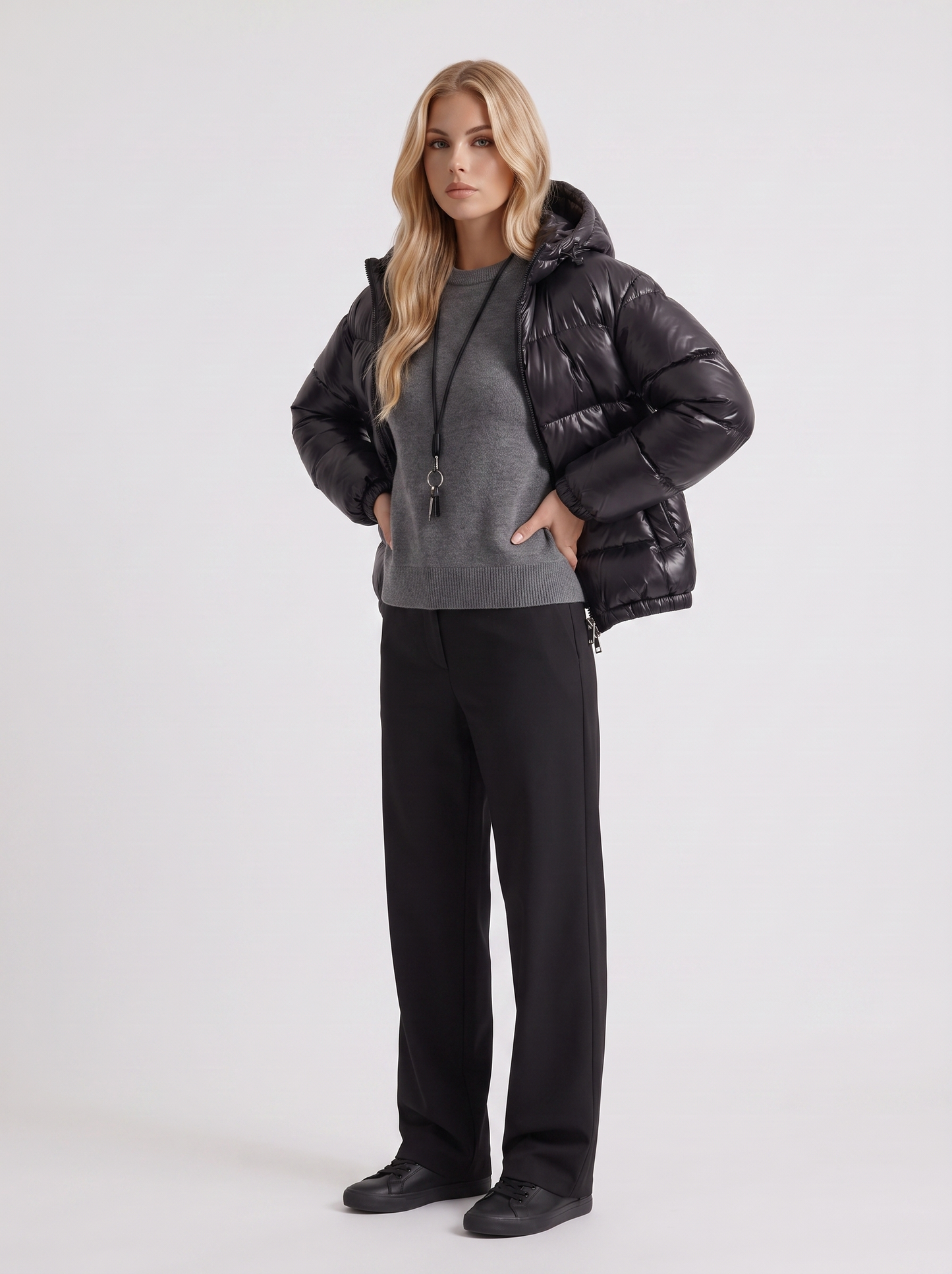 Women black cropped hooded puffer jacket with horizontal quilting and glossy finish, three quarter view