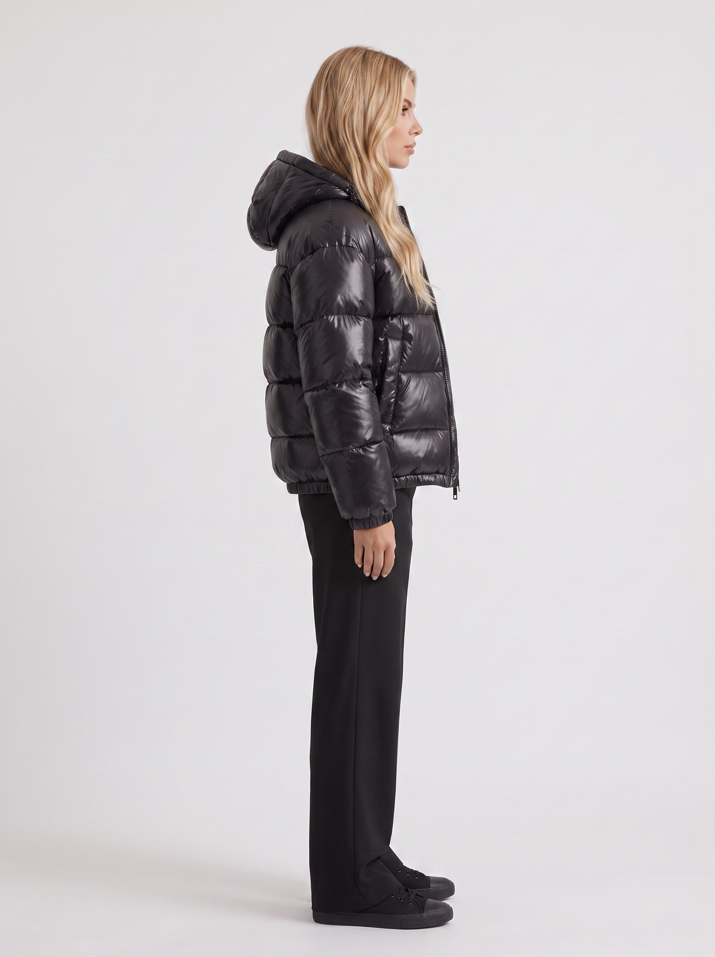 Women black cropped hooded puffer jacket with horizontal quilting and glossy finish, side view