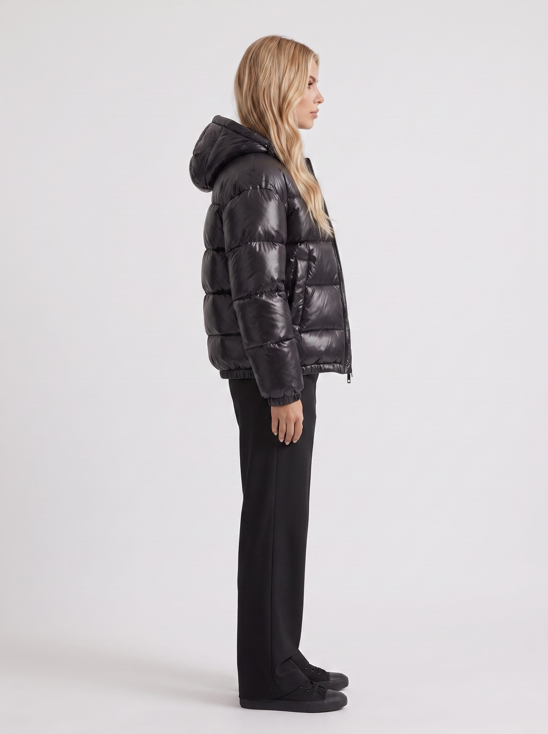 Women black cropped hooded puffer jacket with horizontal quilting and glossy finish, side view