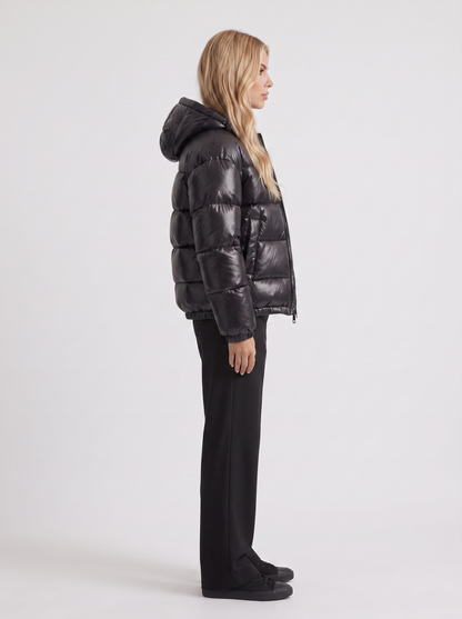 Women black cropped hooded puffer jacket with horizontal quilting and glossy finish, side view