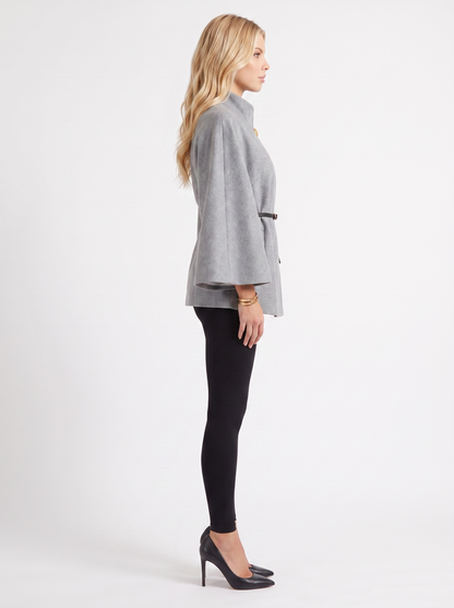 Women gray wool blend cape jacket with funnel neck, button fastening and slim belt, side view
