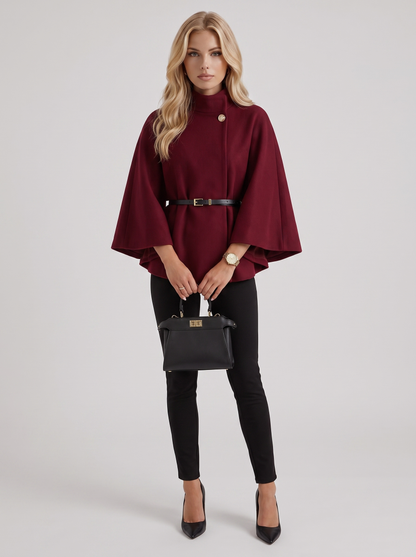 Women burgundy wool blend cape jacket with funnel neck, button fastening and slim belt, front view