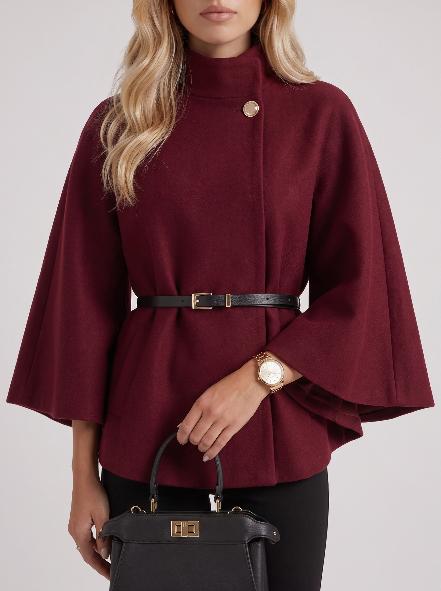 Women burgundy wool blend cape jacket with funnel neck, button fastening and slim belt, fabric closeup