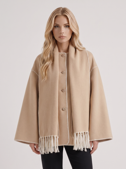 Women beige wool blend coat with attached fringed scarf and blanket stitch edges, front detail