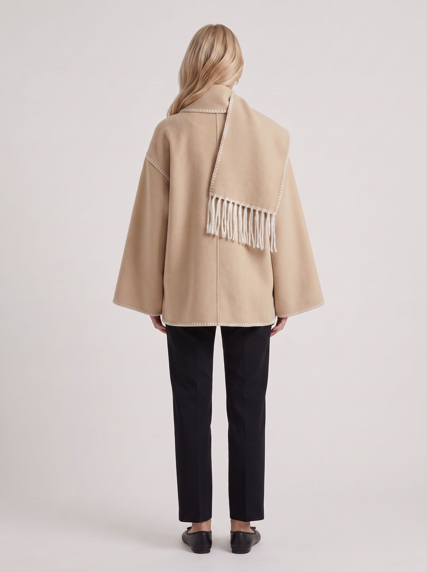 Women beige wool blend coat with attached fringed scarf and blanket stitch edges, back view
