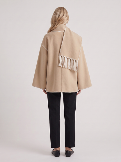 Women beige wool blend coat with attached fringed scarf and blanket stitch edges, back view