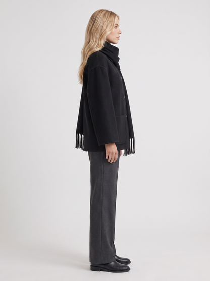 Women black wool blend coat with attached fringed scarf and blanket stitch edges, side view