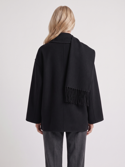 Women black wool blend coat with attached fringed scarf and blanket stitch edges, back view