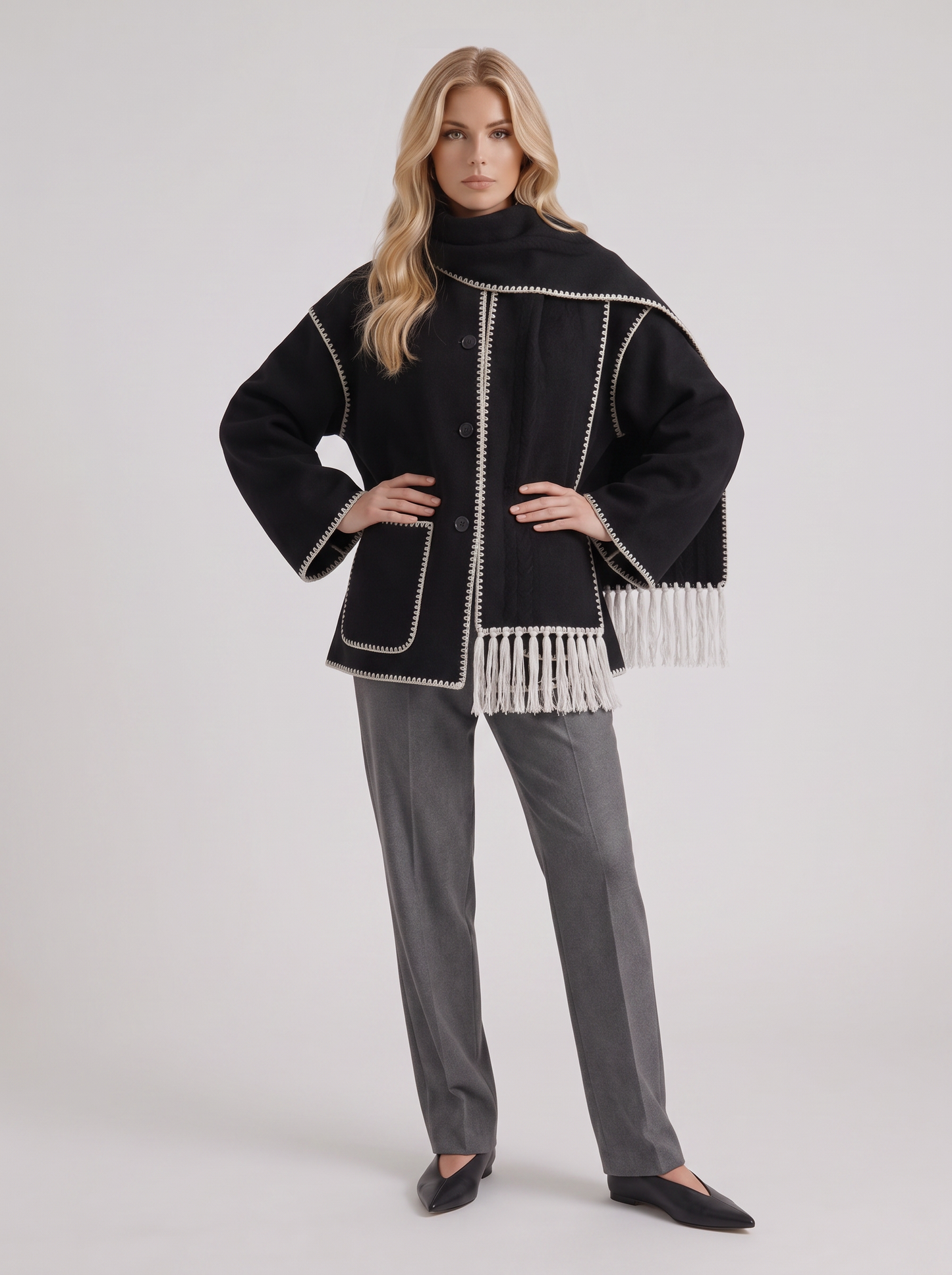 Women dark gray wool blend coat with attached fringed scarf and blanket stitch edges, three quarter view