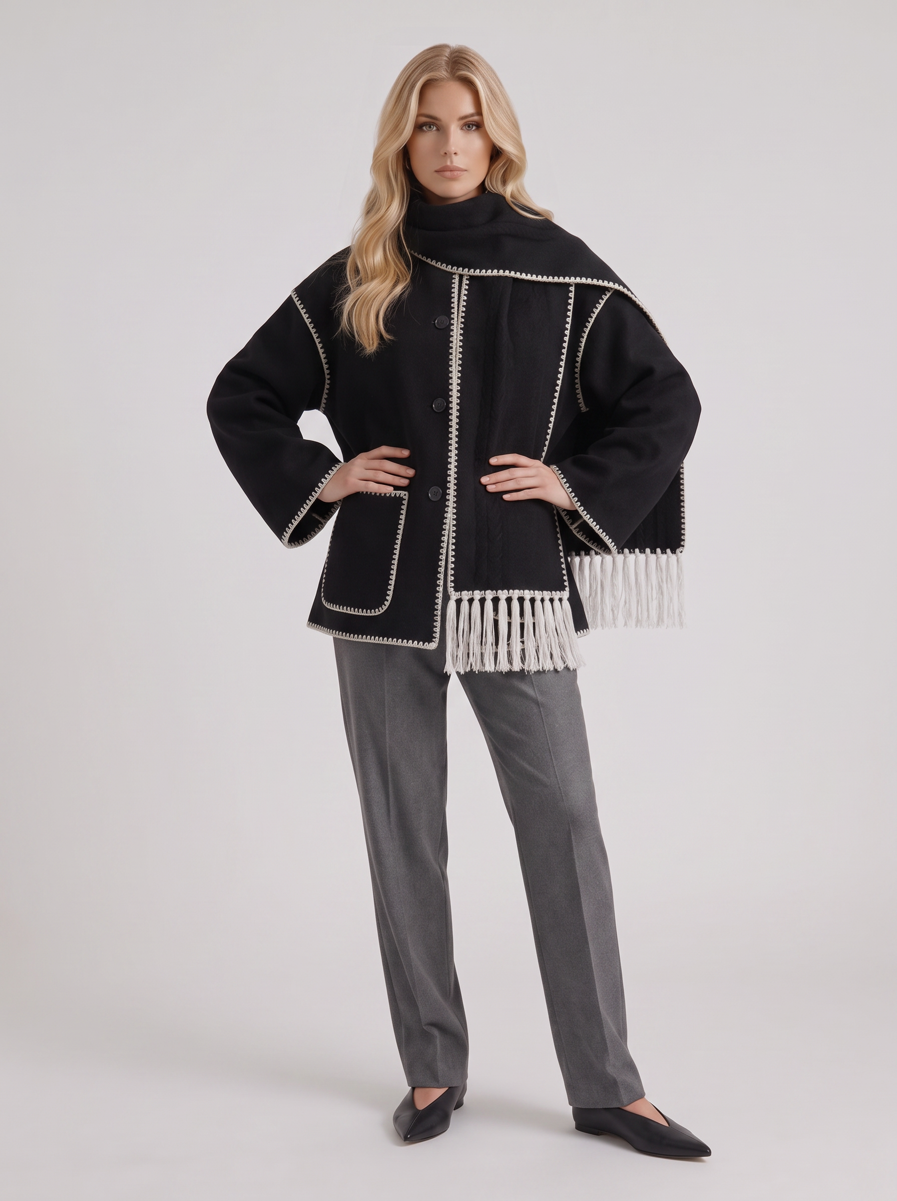 Women dark gray wool blend coat with attached fringed scarf and blanket stitch edges, three quarter view