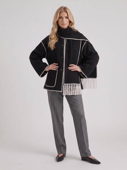 Women dark gray wool blend coat with attached fringed scarf and blanket stitch edges, three quarter view