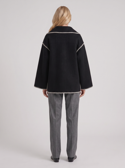 Women dark gray wool blend coat with attached fringed scarf and blanket stitch edges, back view