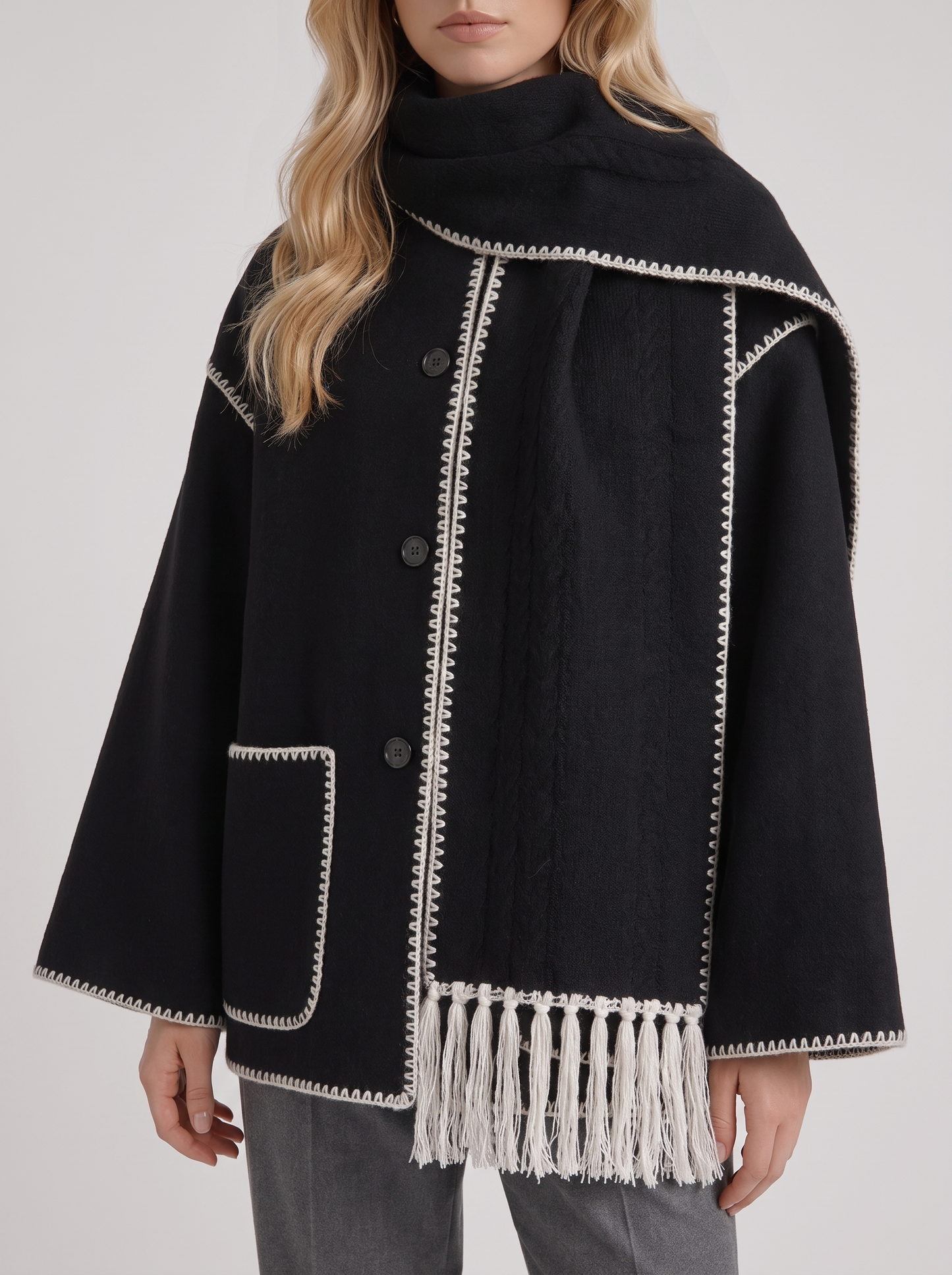 Women dark gray wool blend coat with attached fringed scarf and blanket stitch edges, fabric closeup