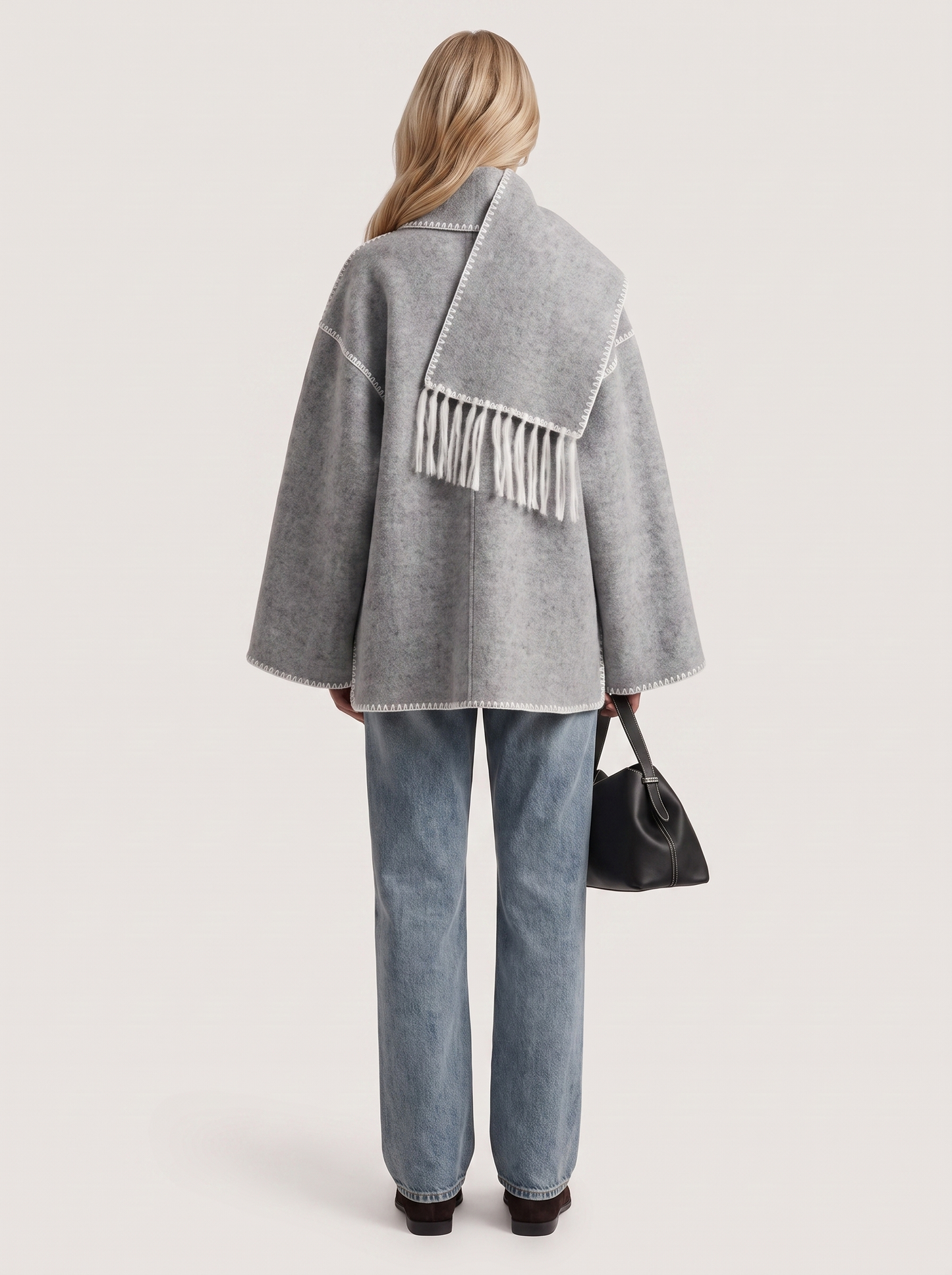 Women light gray wool blend coat with attached fringed scarf and blanket stitch edges, back view