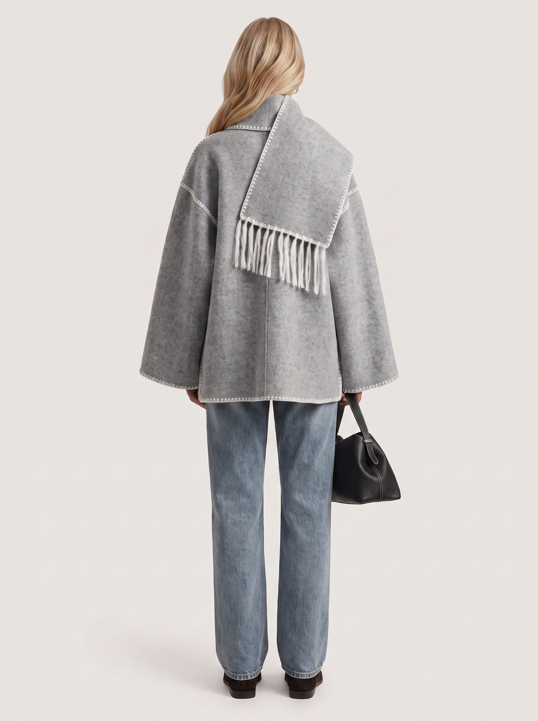 Women light gray wool blend coat with attached fringed scarf and blanket stitch edges, back view
