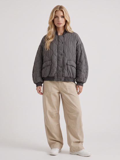 Women charcoal oversized onion quilted bomber jacket with snap front and ribbed trims, front view