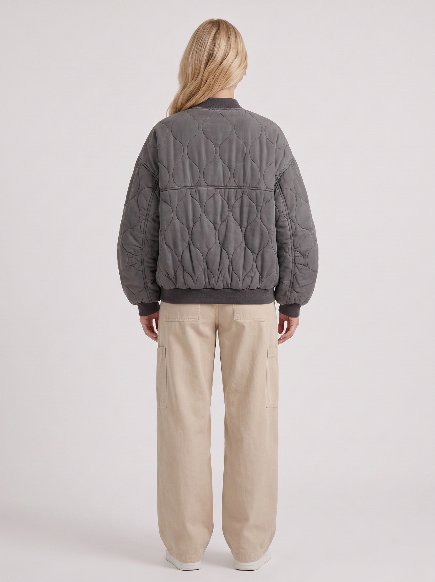 Women charcoal oversized onion quilted bomber jacket with snap front and ribbed trims, back view