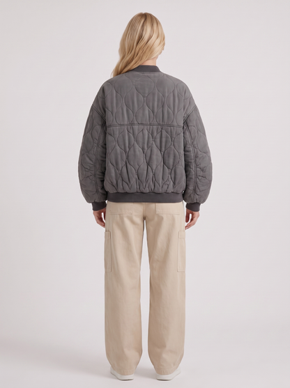 Women charcoal oversized onion quilted bomber jacket with snap front and ribbed trims, back view