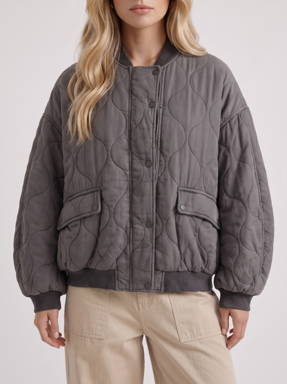 Women charcoal oversized onion quilted bomber jacket with snap front and ribbed trims, fabric closeup