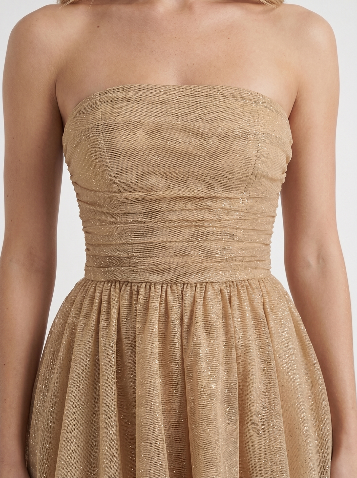 Women gold sequin sparkle mini dress closeup of ruched bodice and sequin shimmer