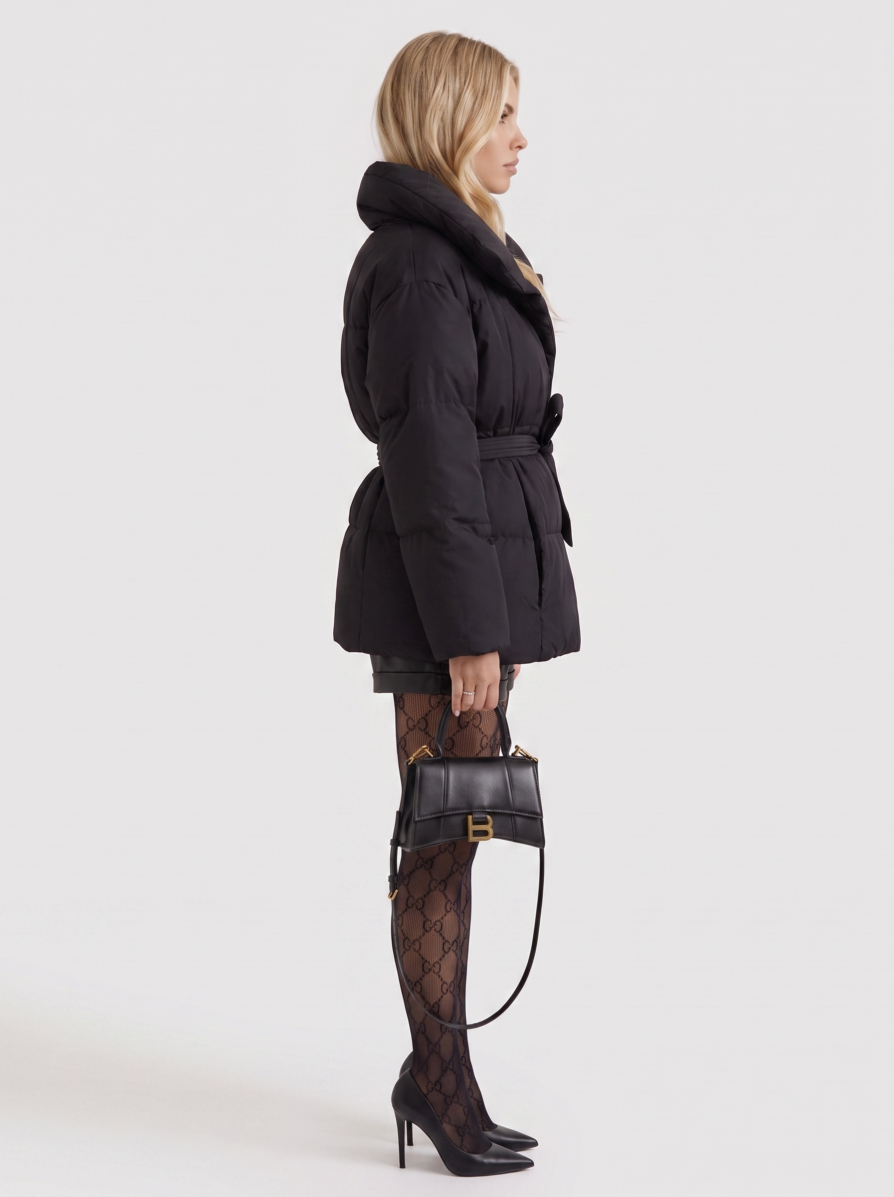 Women black oversized padded jacket with wide portrait collar and tie waist belt, side view