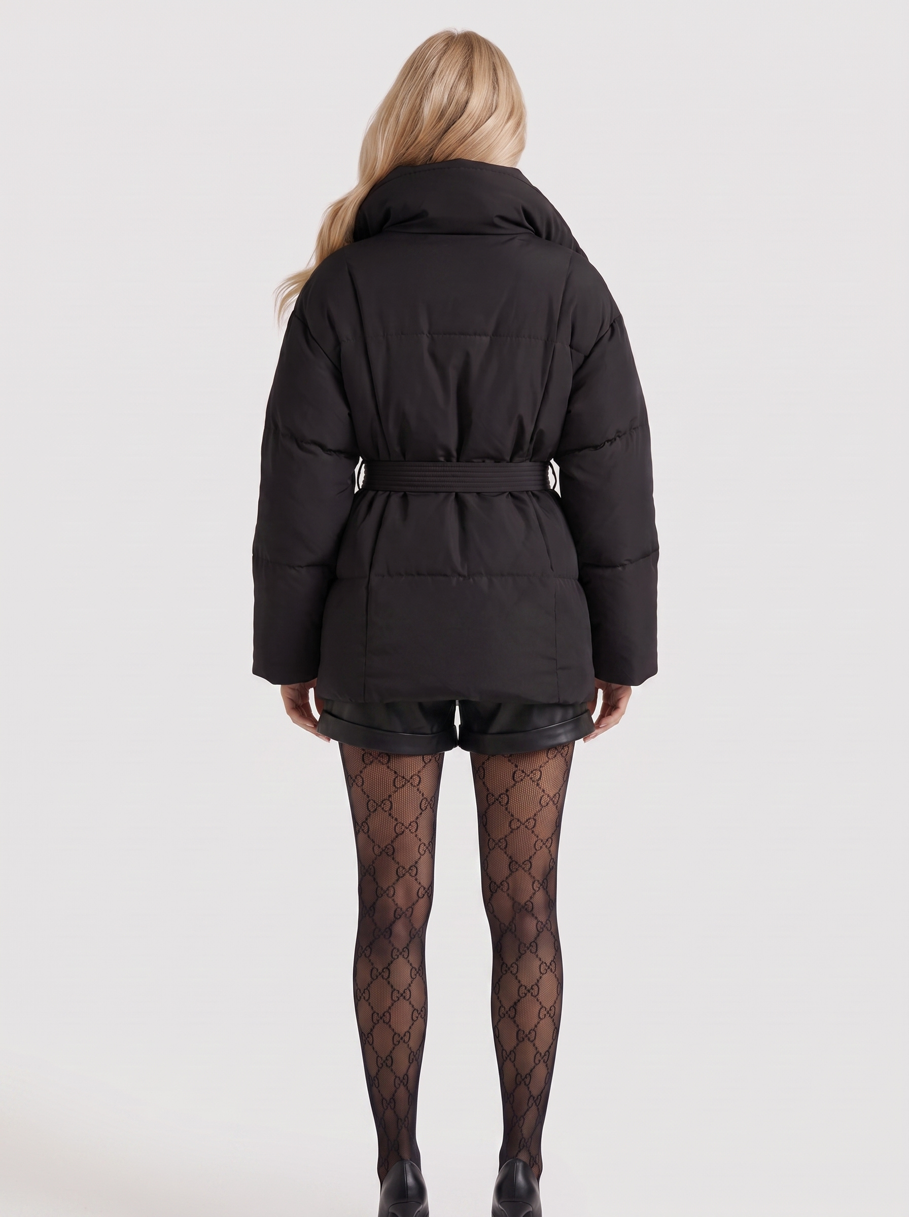 Women black oversized padded jacket with wide portrait collar and tie waist belt, back view