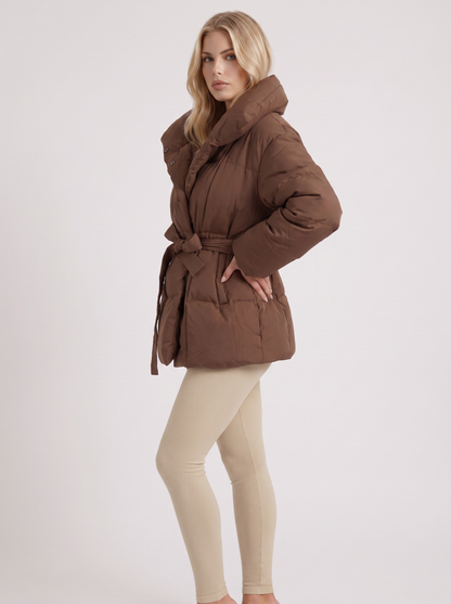 Women brown oversized padded jacket with wide portrait collar and tie waist belt, three quarter view