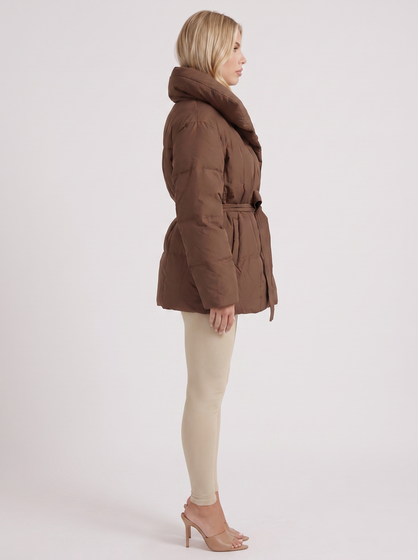 Women brown oversized padded jacket with wide portrait collar and tie waist belt, side view