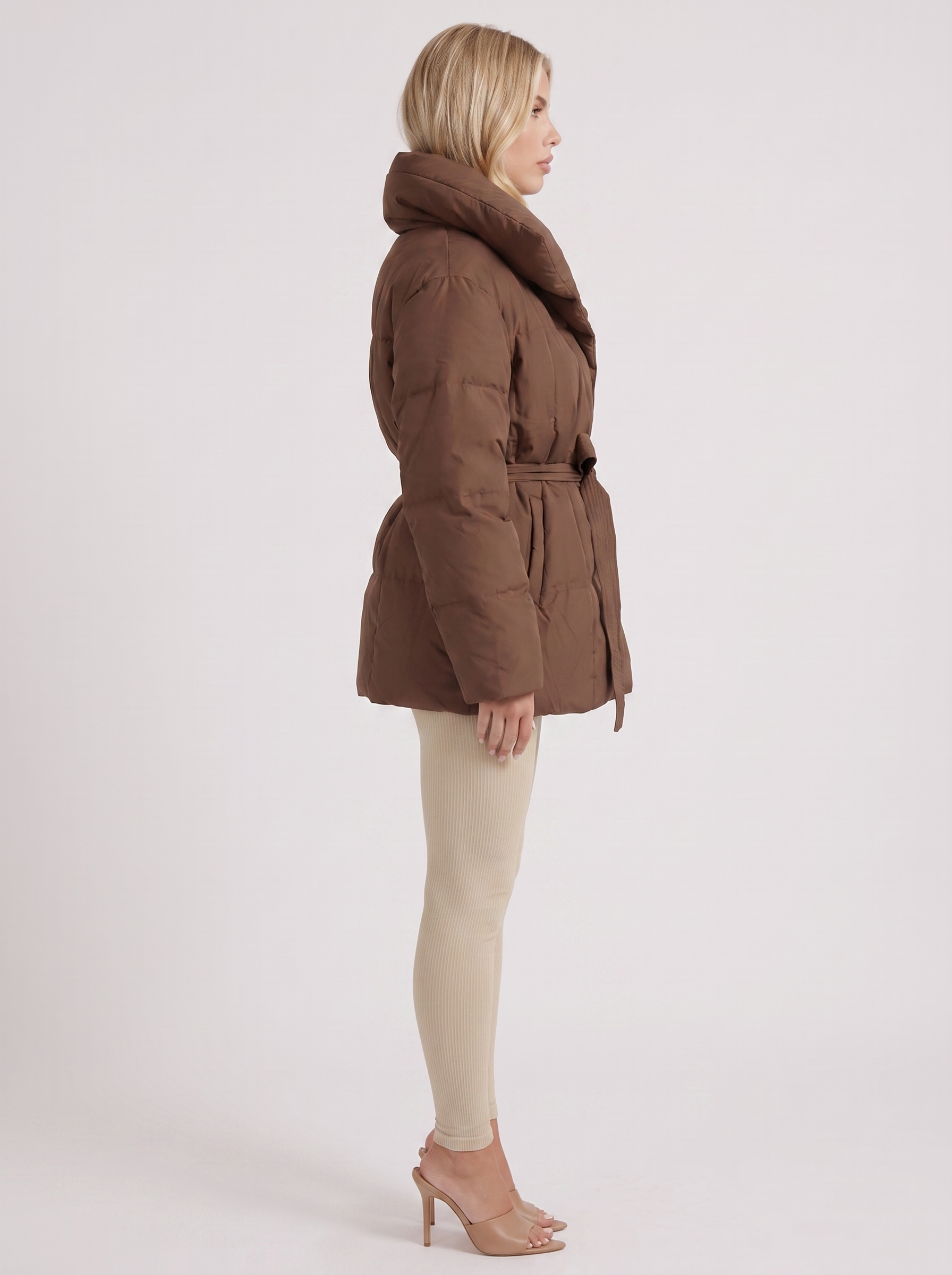 Women brown oversized padded jacket with wide portrait collar and tie waist belt, side view