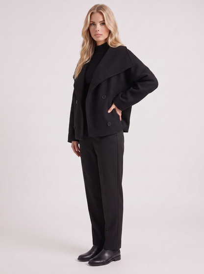 Women black oversized double breasted wool blend peacoat with wide notch collar, three quarter view