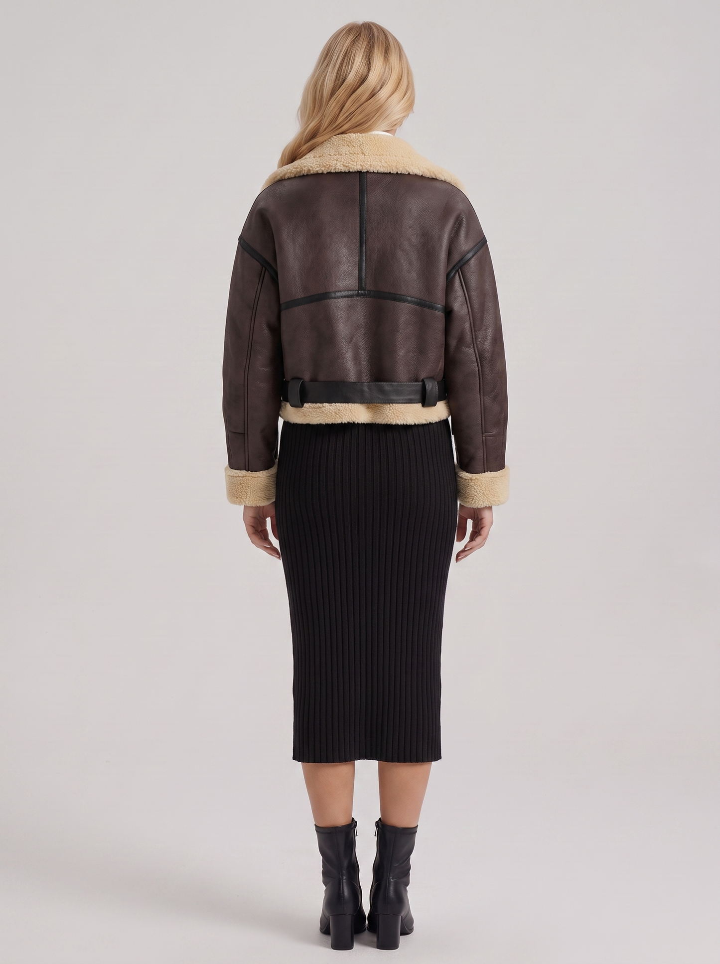 Women brown cropped faux leather aviator jacket with faux shearling collar and belt, back view